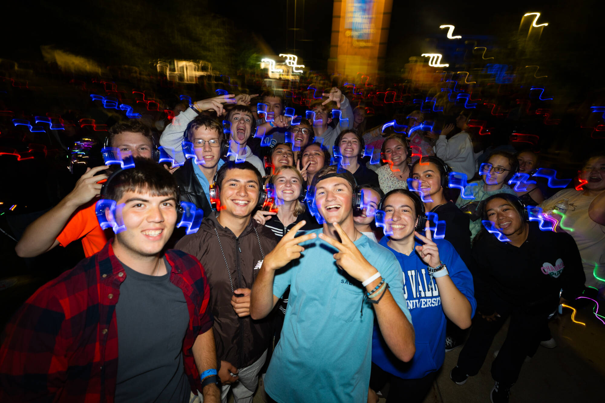 A group of students smiling for the camera at Silent Disco